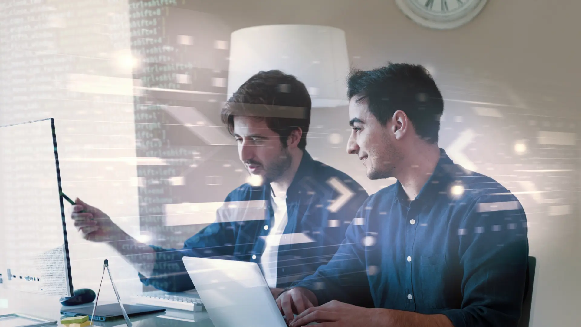 Two men looking over a paper together